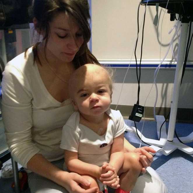 Jack when he was younger, in hospital with his mum, Nadine.