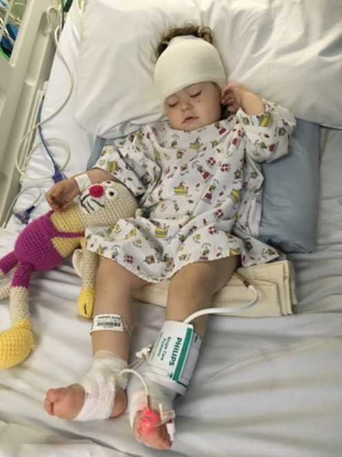 Ryleigh in her hospital bed during treatment for her condition.