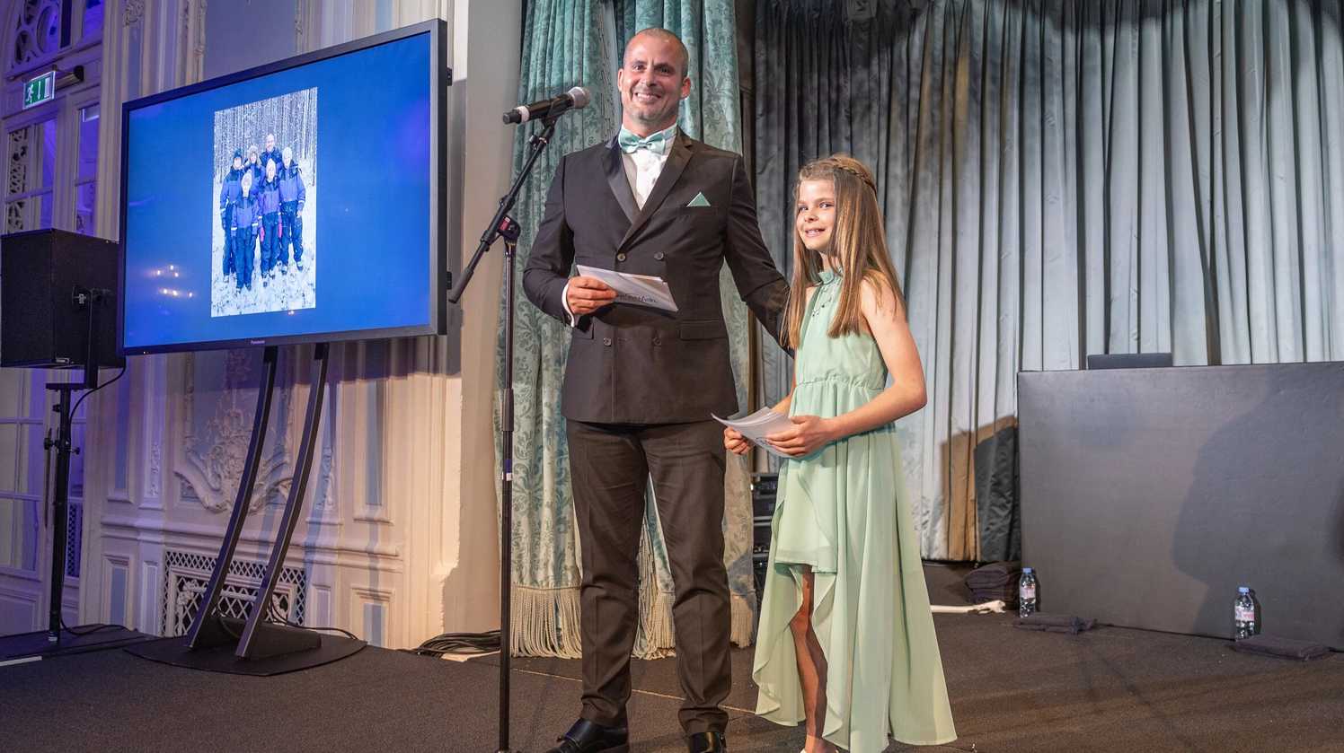 Wish parent Paul Matthews with daughter Rosie Matthews speaking at A Night of Wishes