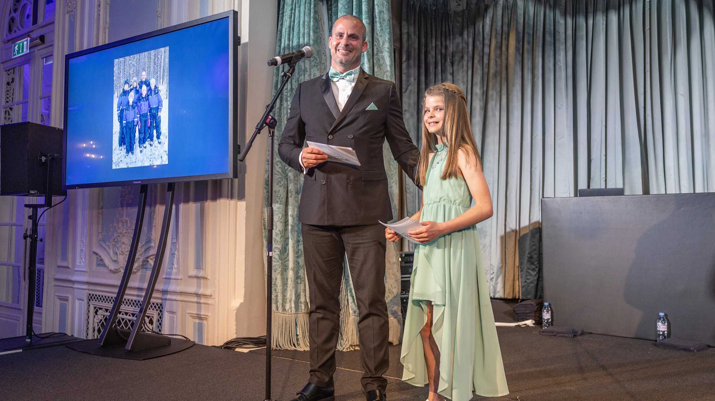 Wish parent Paul Matthews with daughter Rosie Matthews speaking at A Night of Wishes