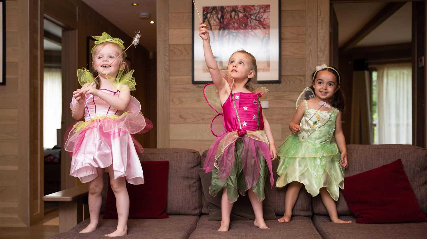 Elsie playing with her cousins and her magic wand