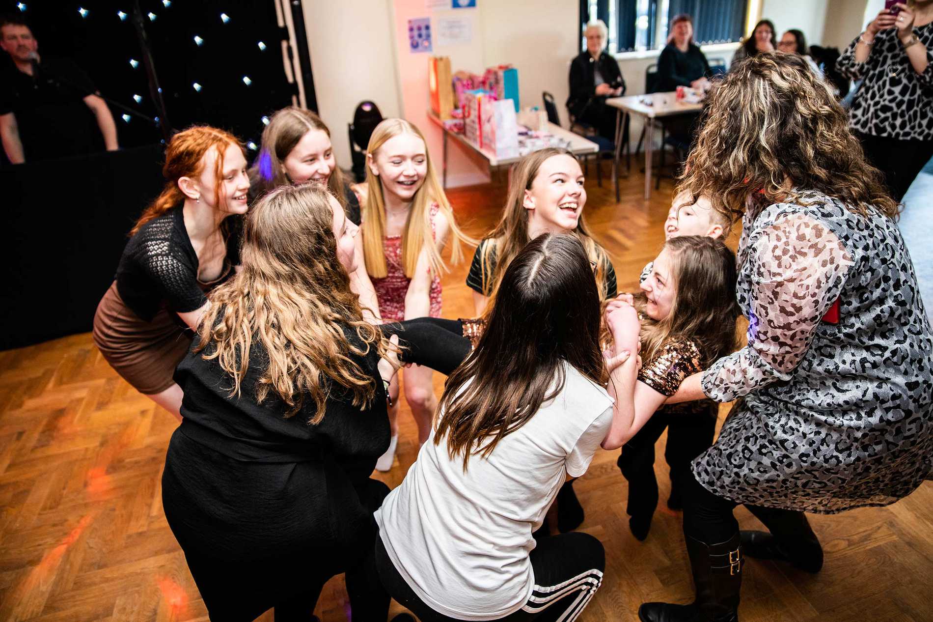 Eloise's mum and friends giving her the birthday bumps.