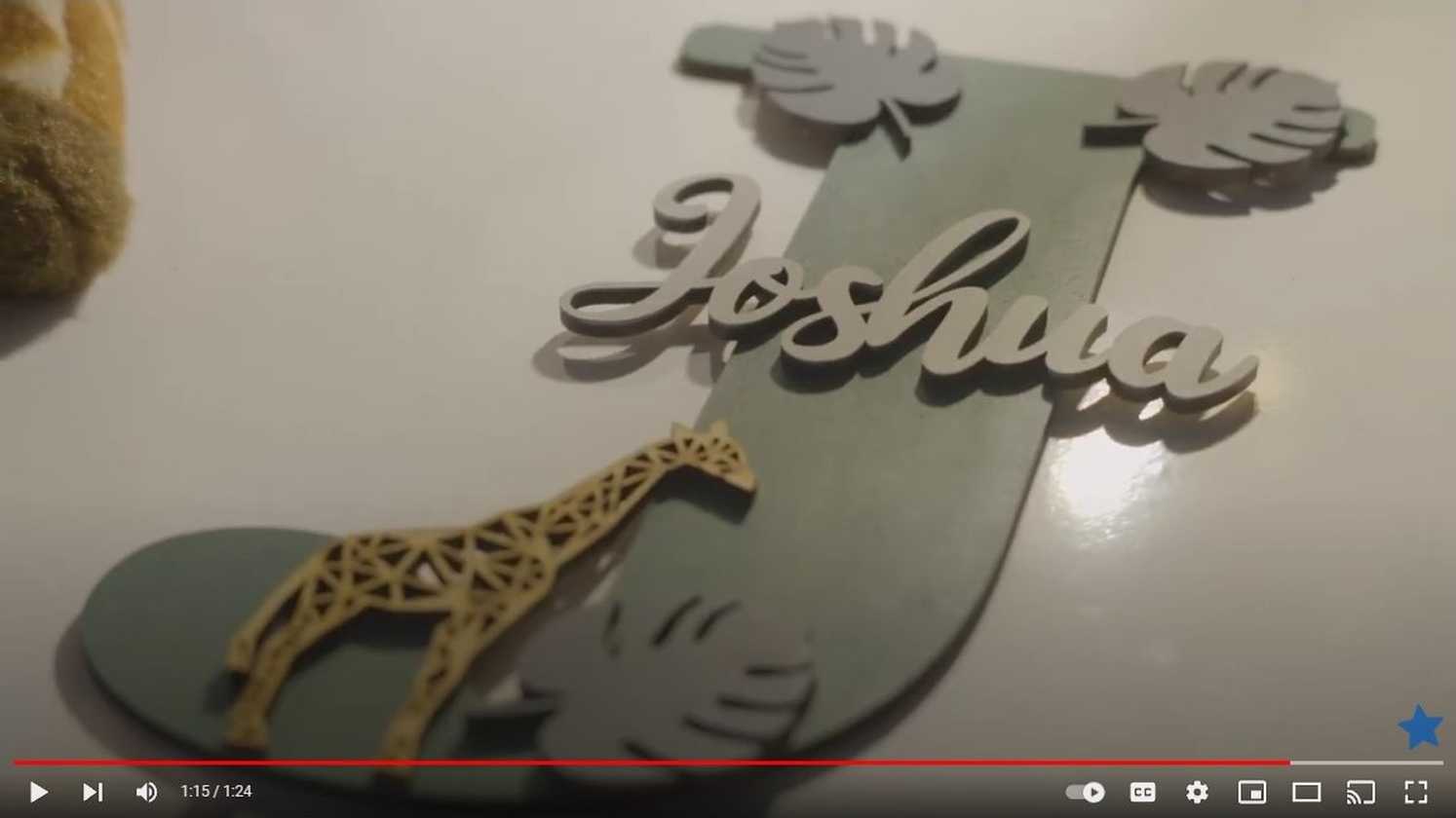 A still taken from the video of Joshua's wish, showing his carved nameplate on his bedroom door.