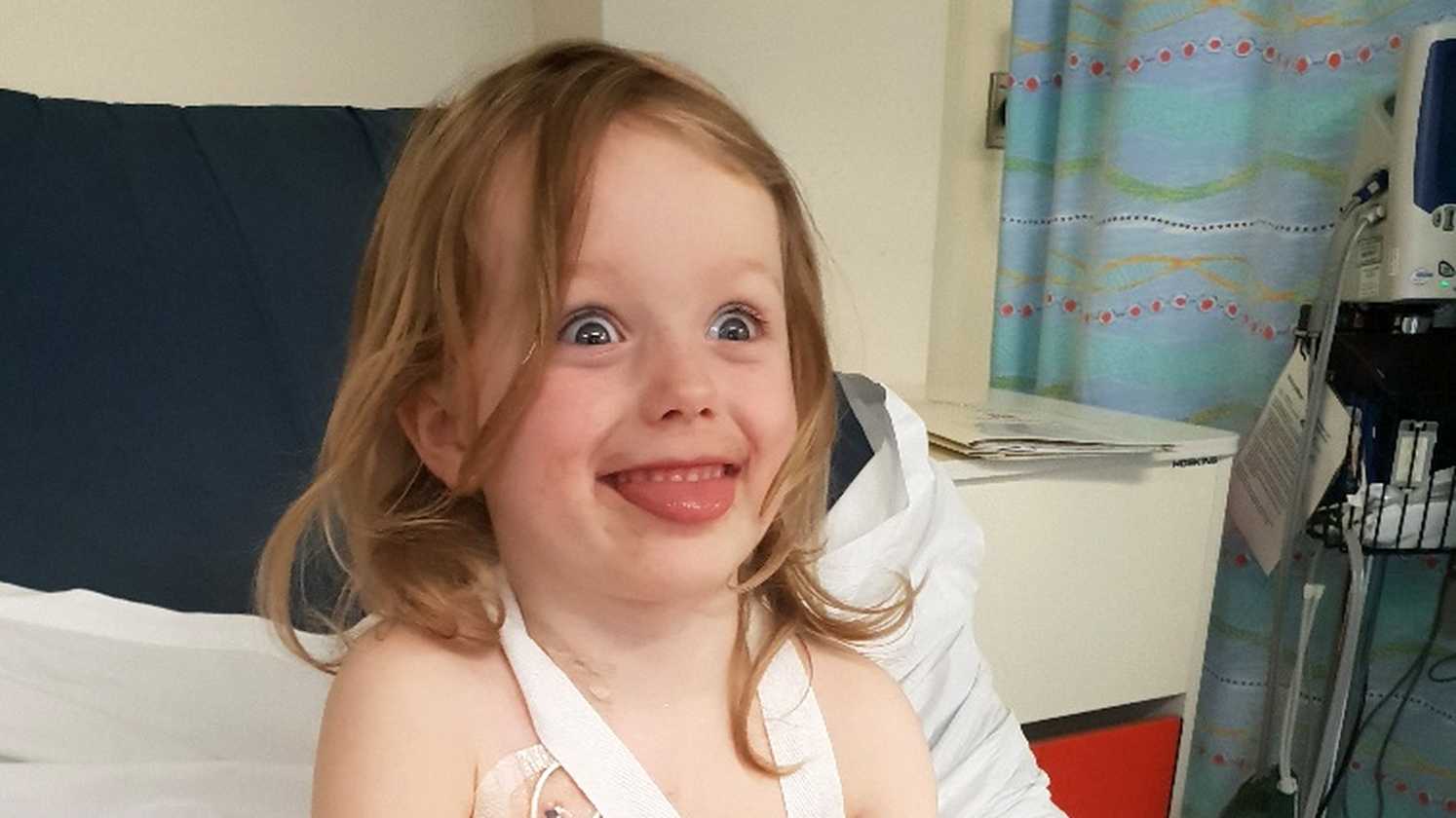 Lottie smiling bravely during her treatment in hospital.